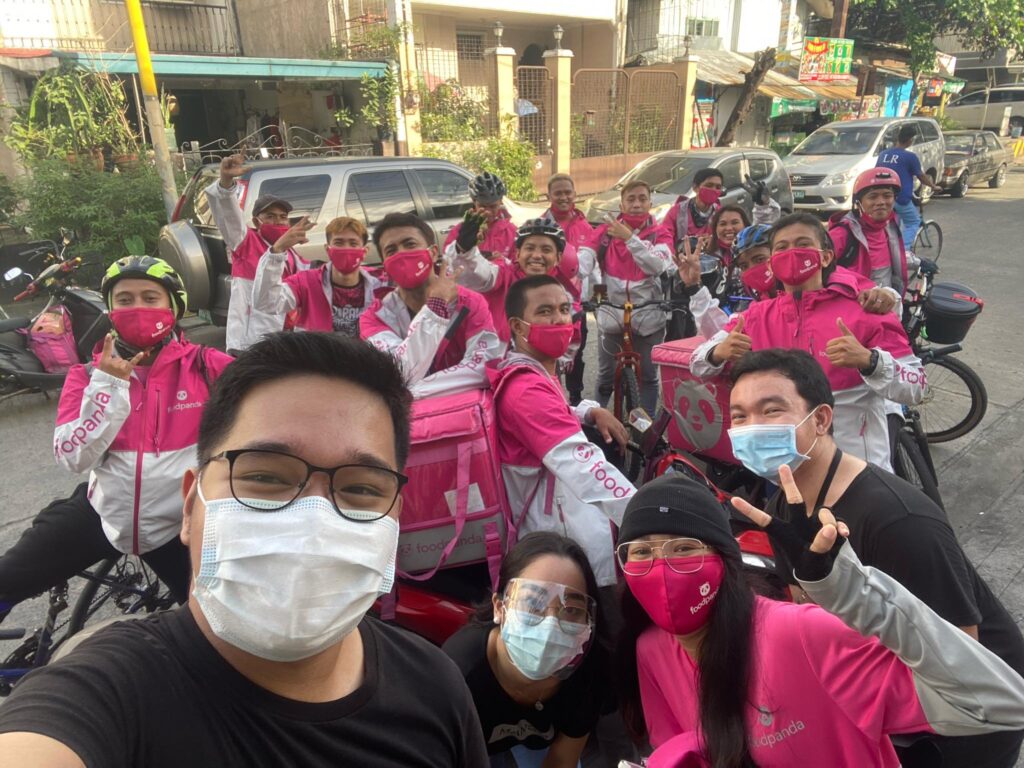 Operations Manager for Community and Communications, Jao Manahan with the foodpanda riders involved in the making of the ‘Magniningning mga Ka-Panda’ music video