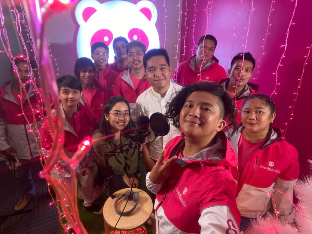 Operations Manager for Community and Communications, Jao Manahan, with Road Rockstars and The Panda Nation foodpanda riders during the shoot of the ‘Magniningning mga Ka-Panda’ music video